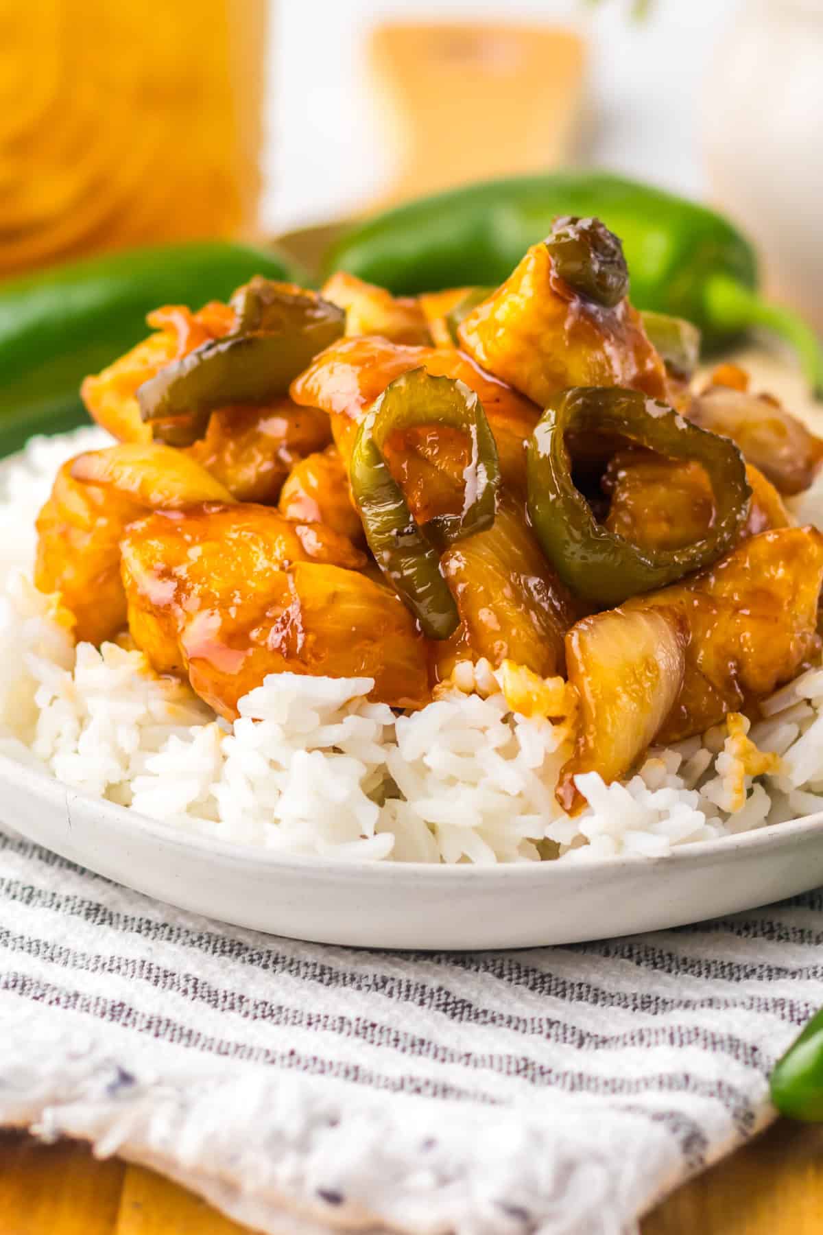 If you love a little heat in your meals, you’ve got to try this Jalapeno Chicken recipe! Crispy chicken tenders are coated in a sticky, spicy jalapeno sauce that packs the perfect punch. It's an easy, mouthwatering dish that’s perfect for busy weeknights when you need something quick but full of flavor. Jalapeno Chicken with rice on a plate