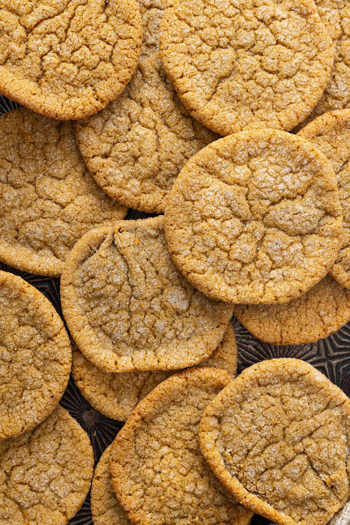 Made with dark brown sugar and molasses, these Easy Brown Sugar Cookies are soft and chewy with a light molasses flavor. Close up of a pile of brown sugar cookies