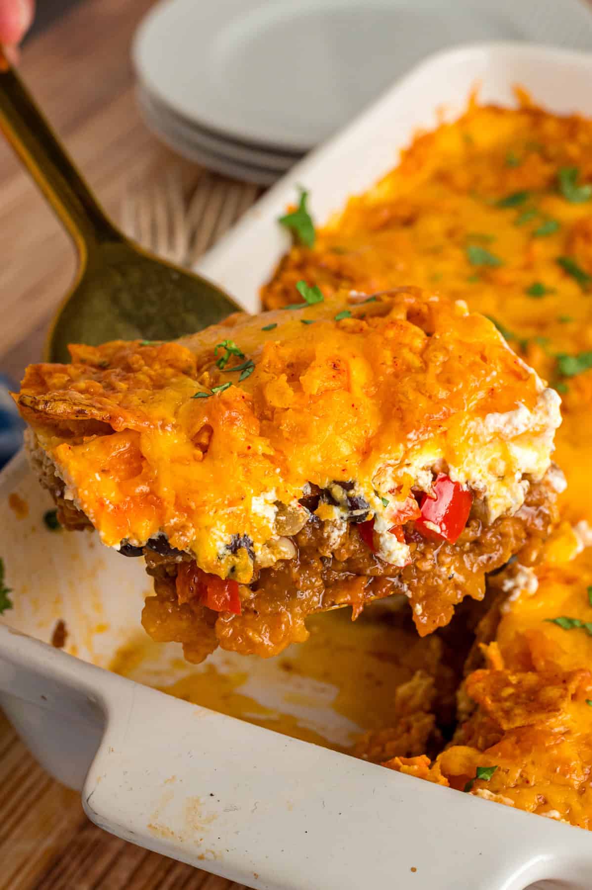With ingredients like ground beef, black beans, Rotel, and lots of cheese, there's no shortage of flavor in this Dorito Casserole recipe. Serving Dorito casserole from a baking dish
