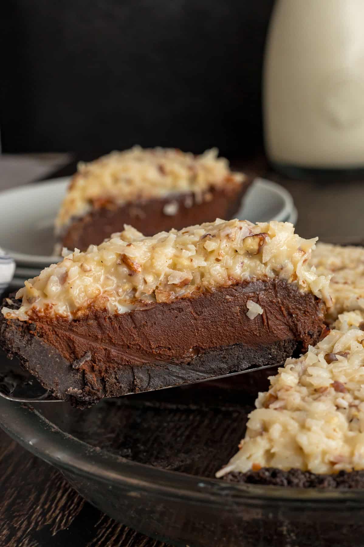 Serving a slice of German chocolate pie from the pie dish