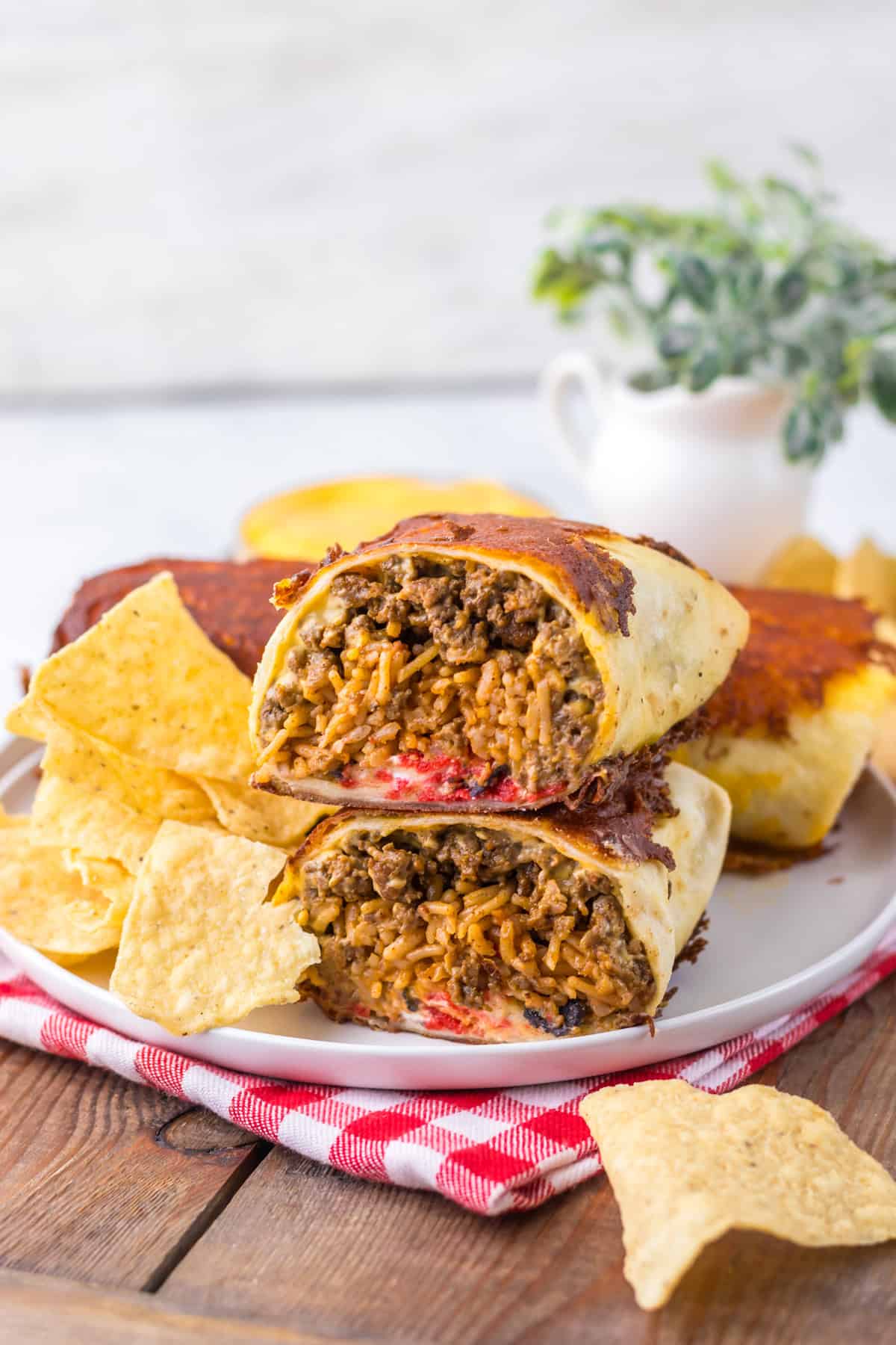 Two halves of a copycat Taco Bell grilled cheese burrito on a plate