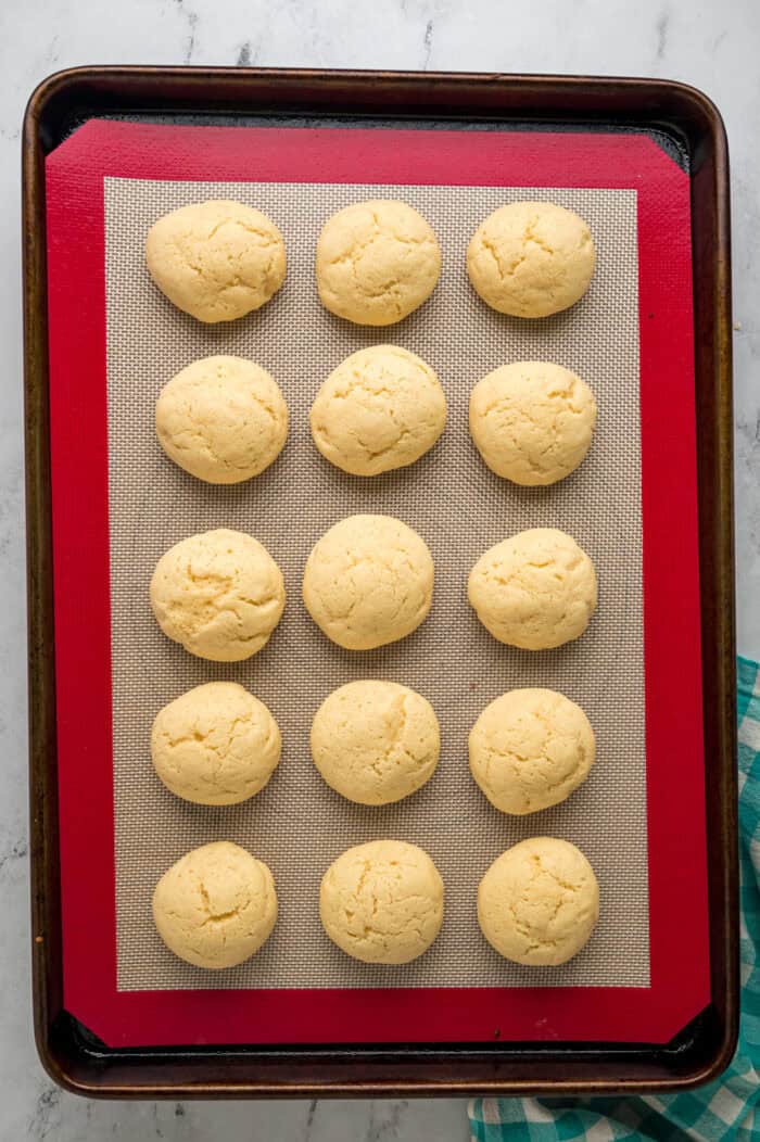 Overhead view of unfrosted Lofthouse cookies on a cookie sheet
