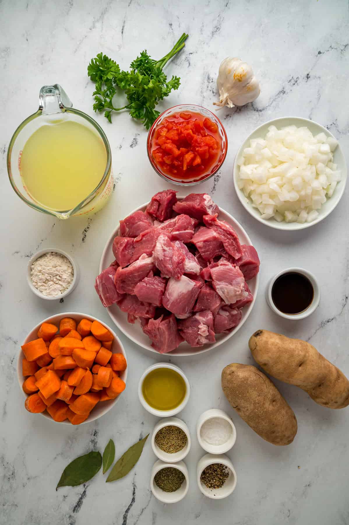 Overhead view of ingredients needed to make pork stew