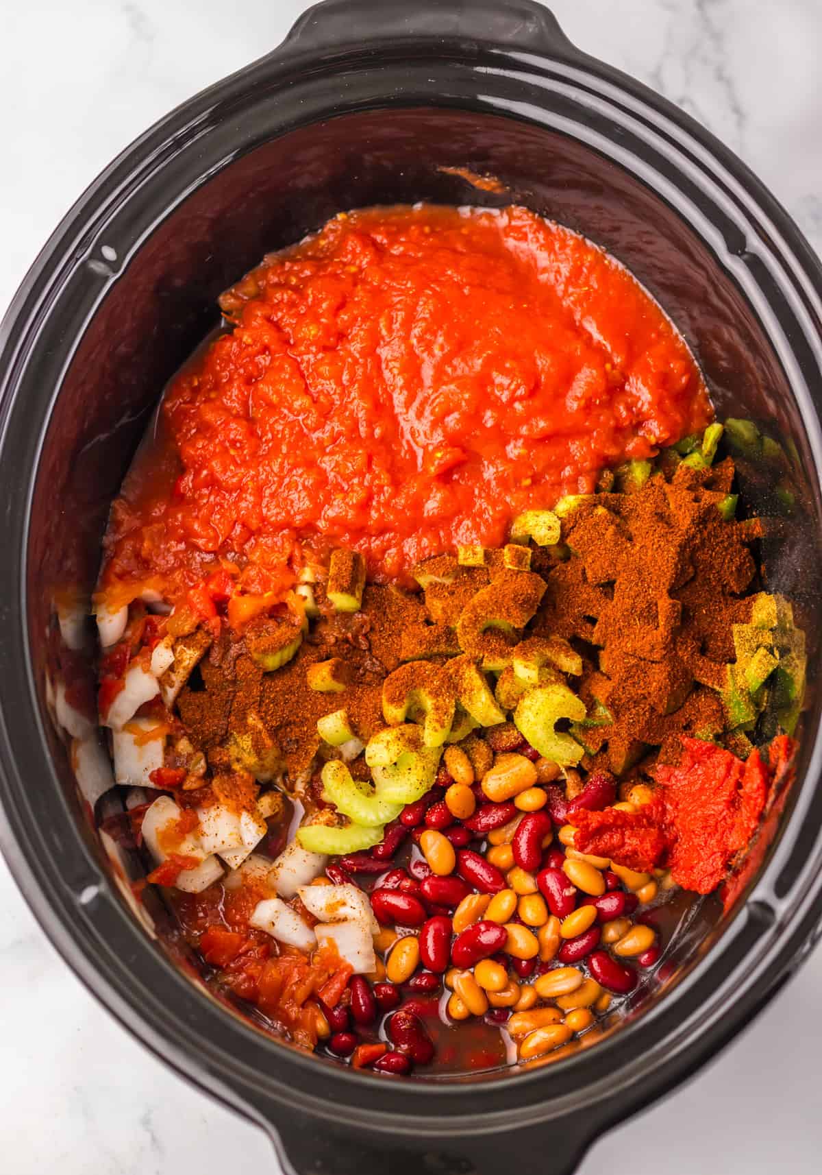 Wendy's chili recipe ingredients in a slow cooker