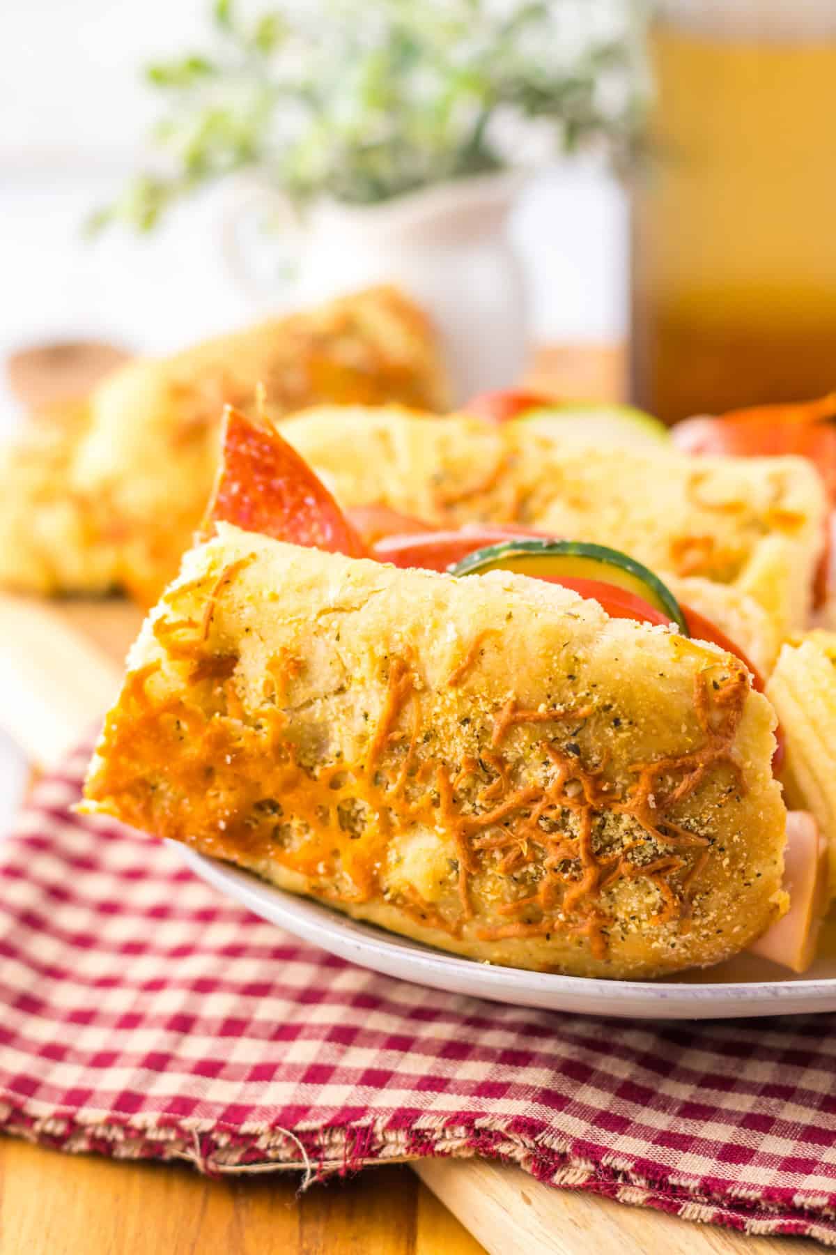 Italian Herb Cheese Bread sub sandwich on white plate