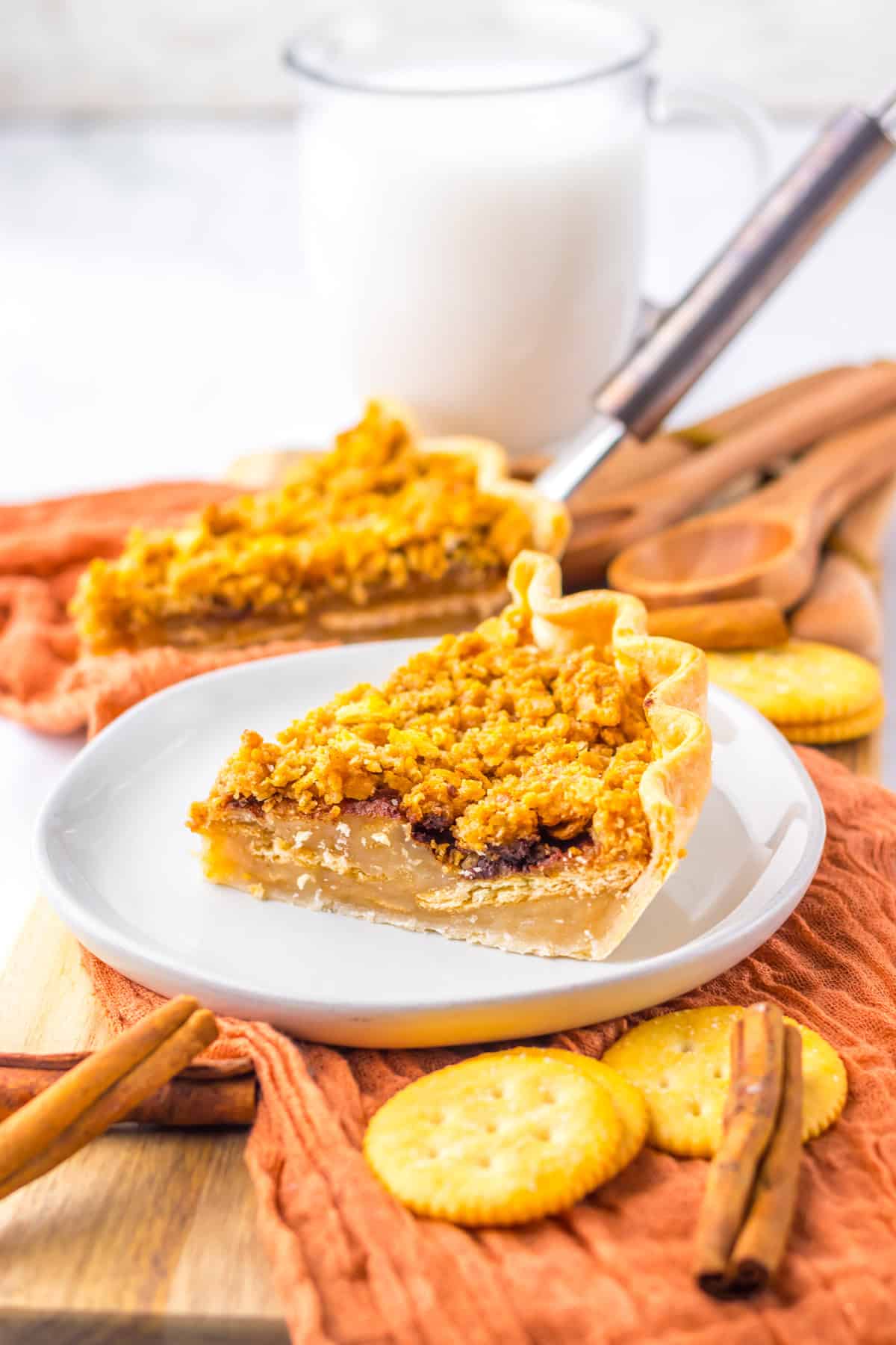 This Mock Apple Pie looks and tastes like the real thing! slice of mock apple pie on white plate with glass of milk