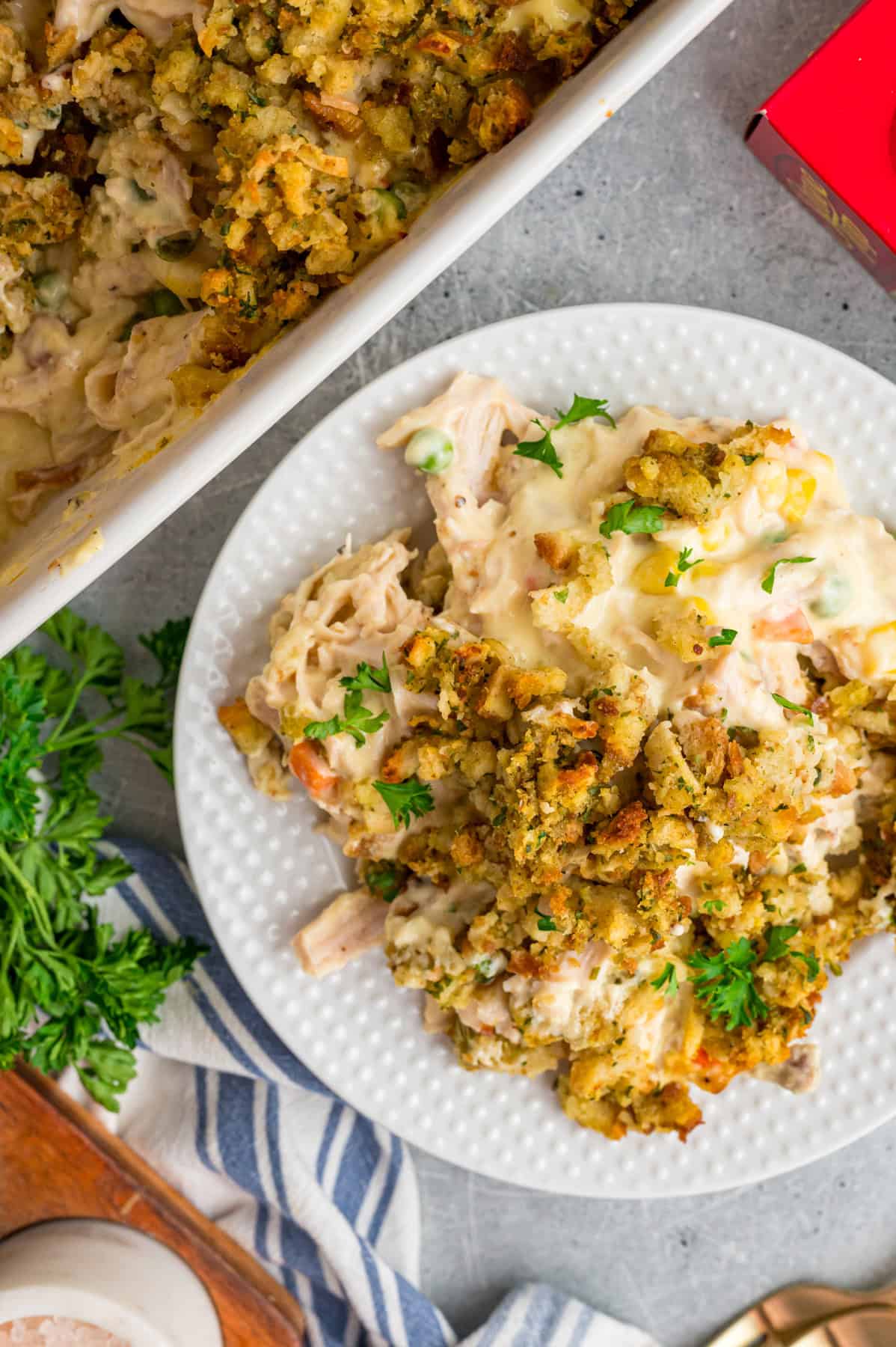 Overhead view of a white plate of chicken and stuffing casserole