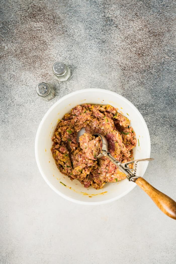 Ground pork meatball mixture in a bowl