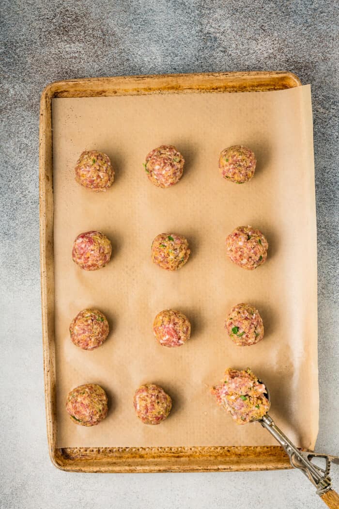 Pork meatballs on a baking sheet