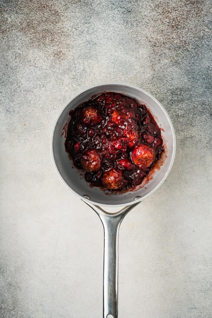 Cranberry meatballs in a saucepan