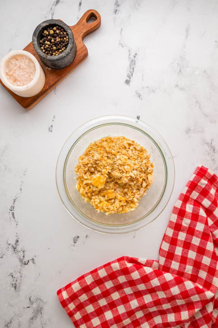 Crushed Ritz crackers and butter in a small bowl