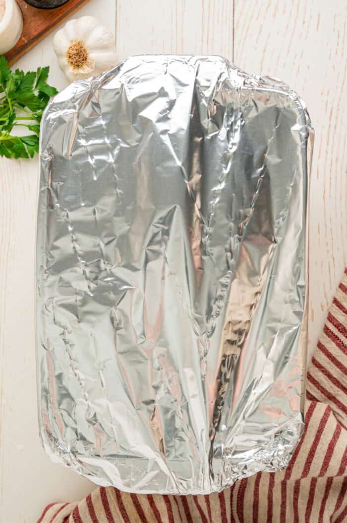A baking dish covered with foil