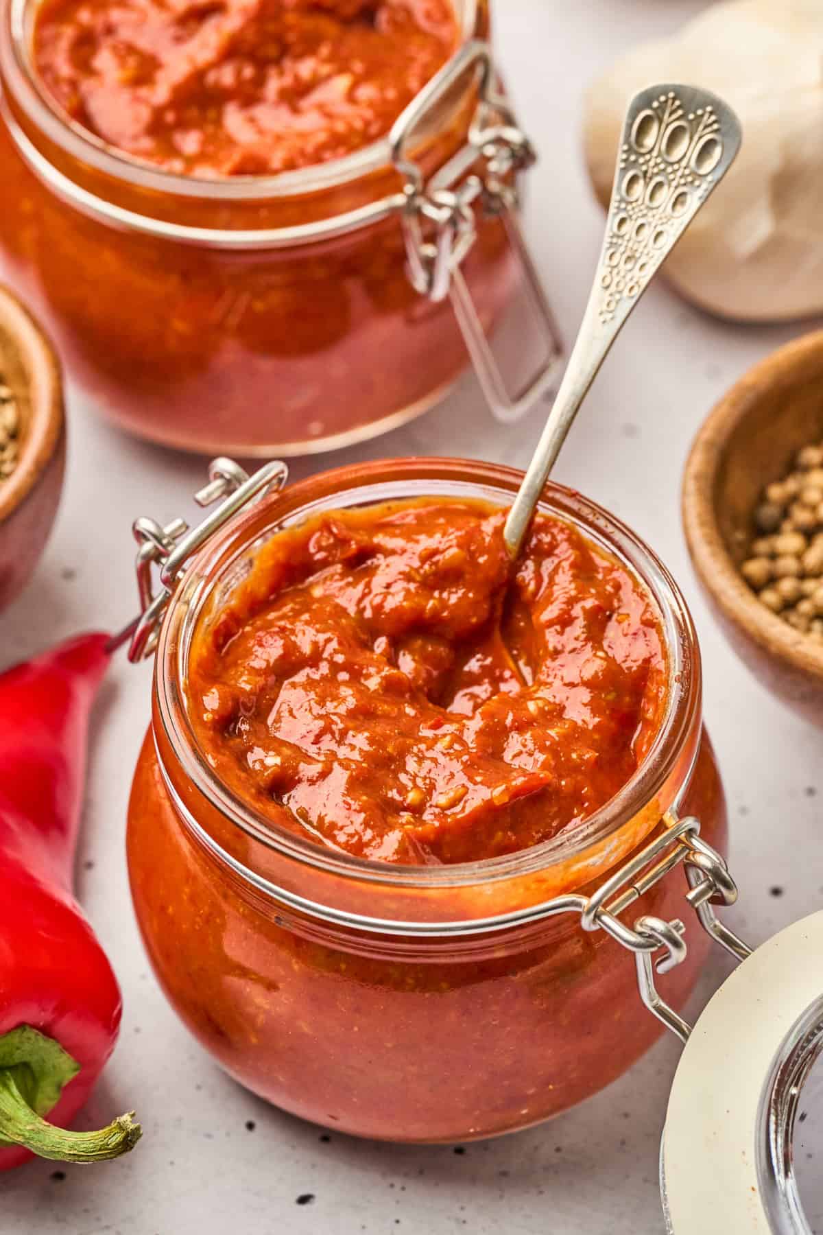 Made with red chilies, red peppers, and spices, this Harissa Sauce is warm and smoky with just the right amount of heat. Harissa Sauce Recipe in jars