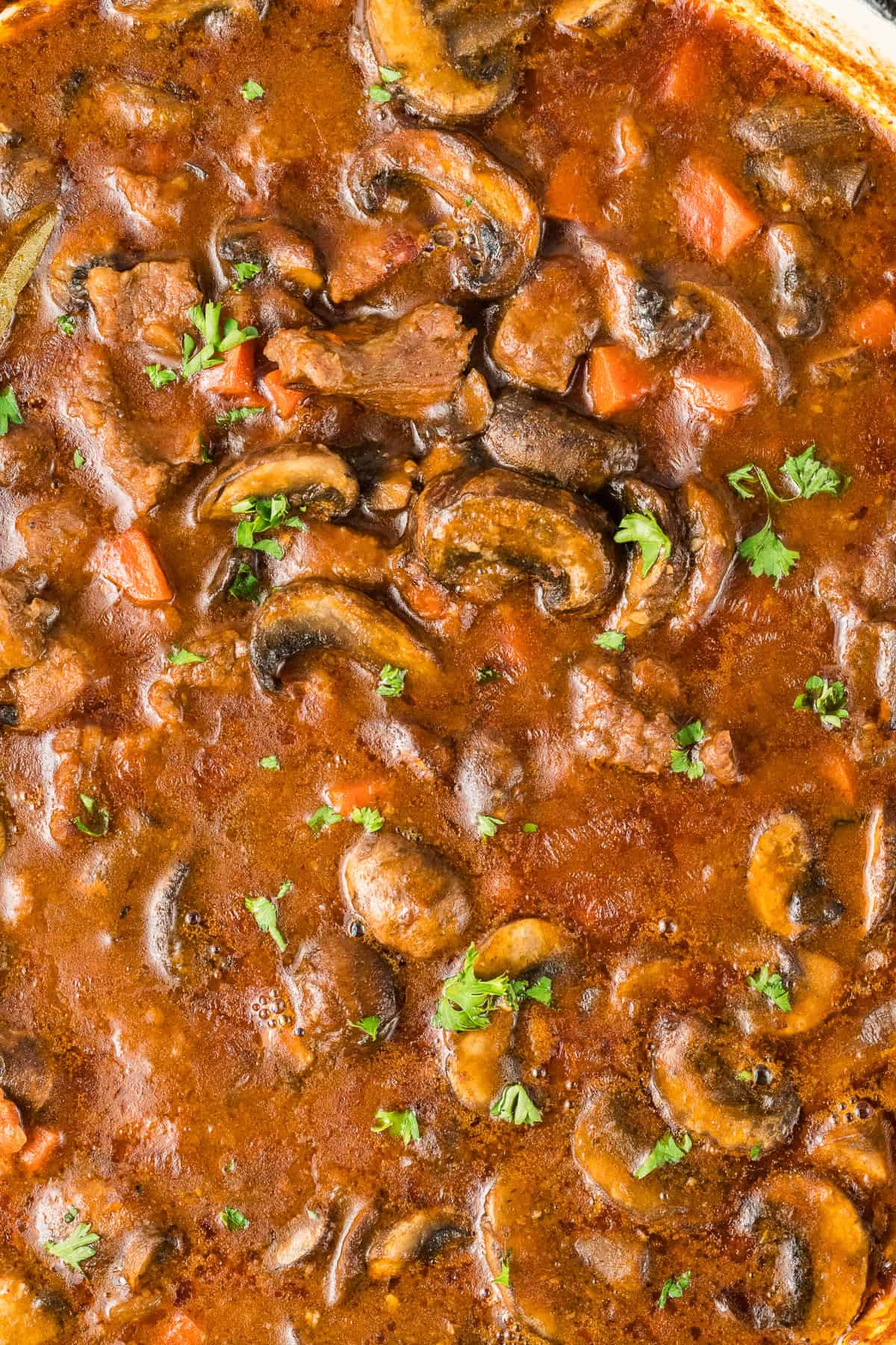 Close up of a pot of beef and mushroom stew