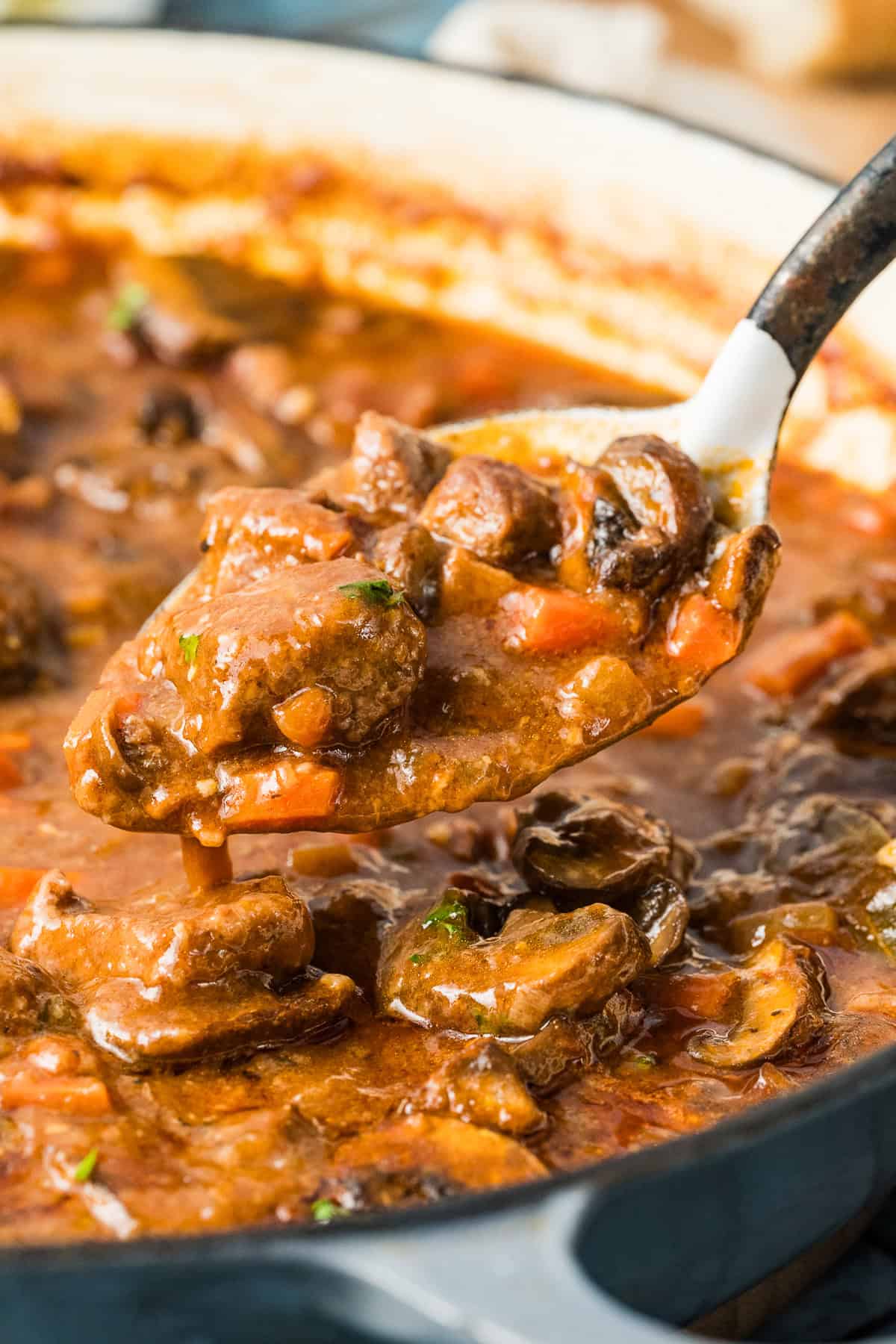 Close up of a spoonful of beef and mushroom stew
