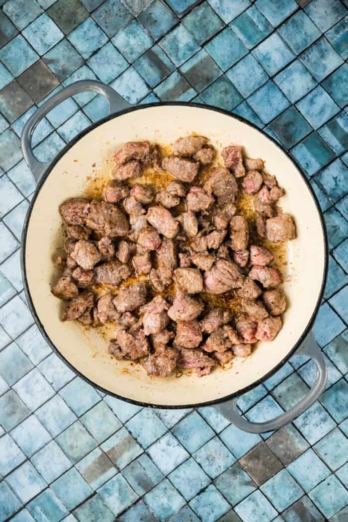 Seared stew meat in a pot