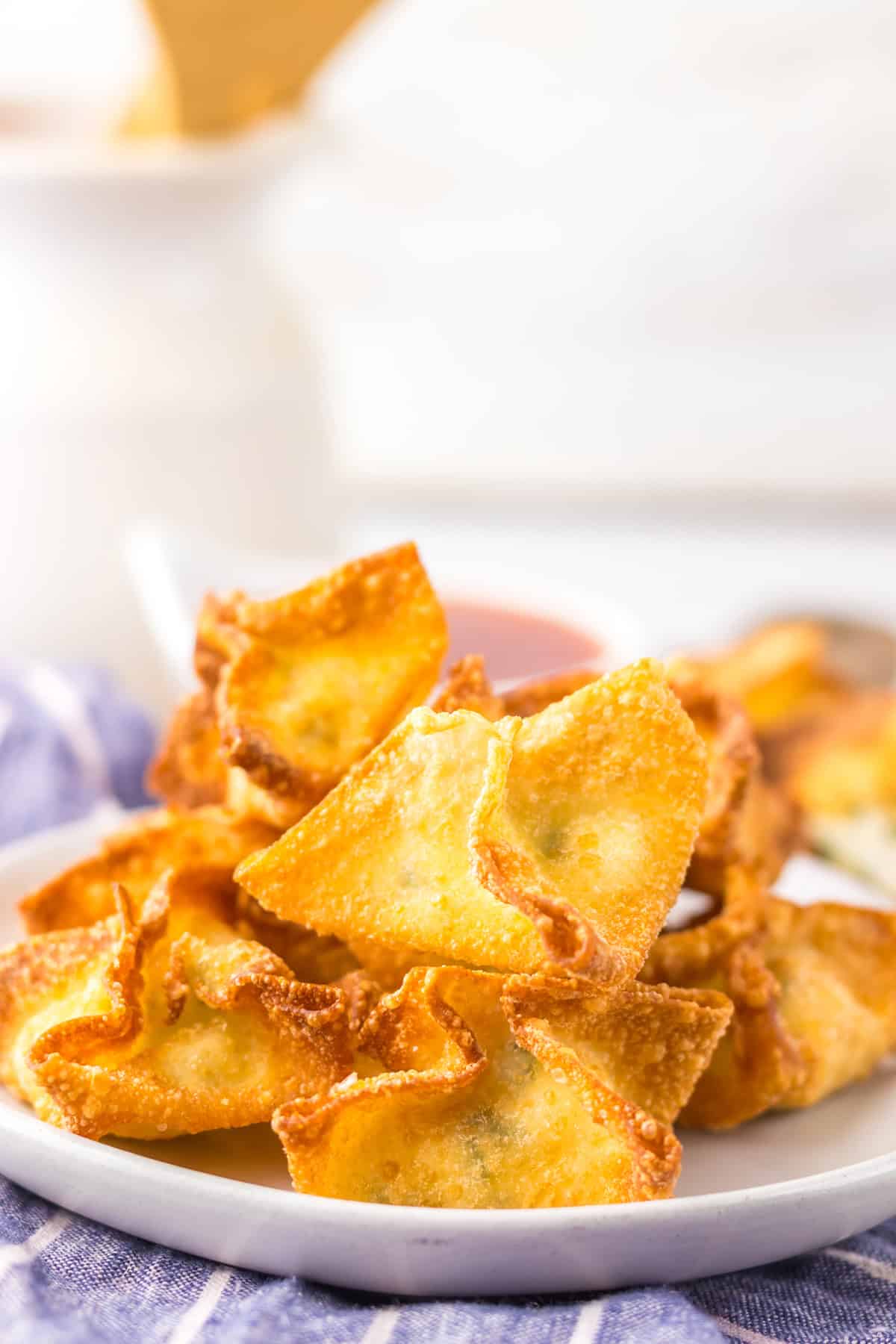Cream cheese rangoon piled on a plate