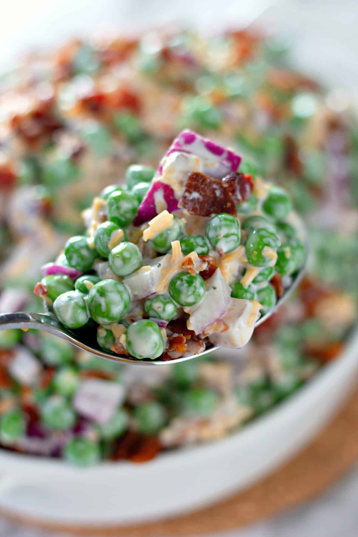 serving spoon of pea salad