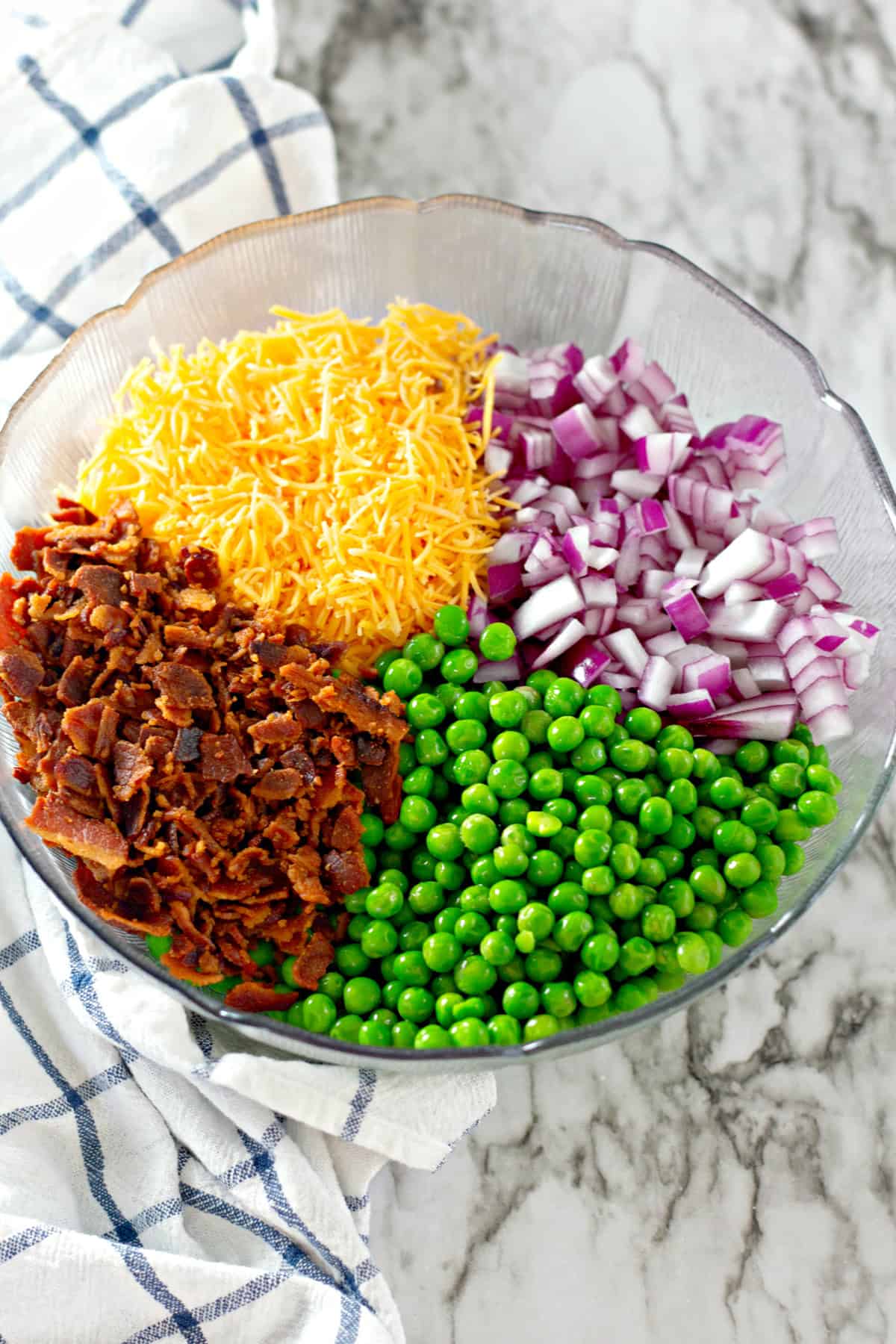 ingredients in bowl for pea salad