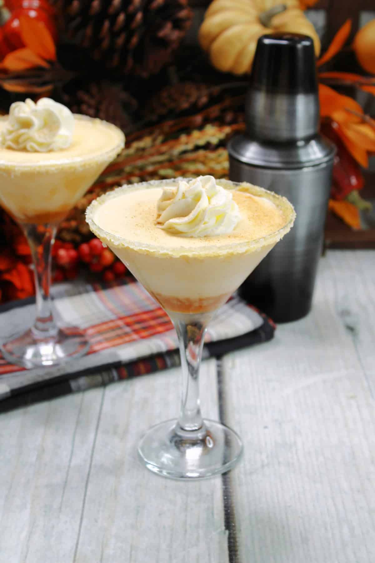 Pumpkin Martini in glasses with shaker bottle