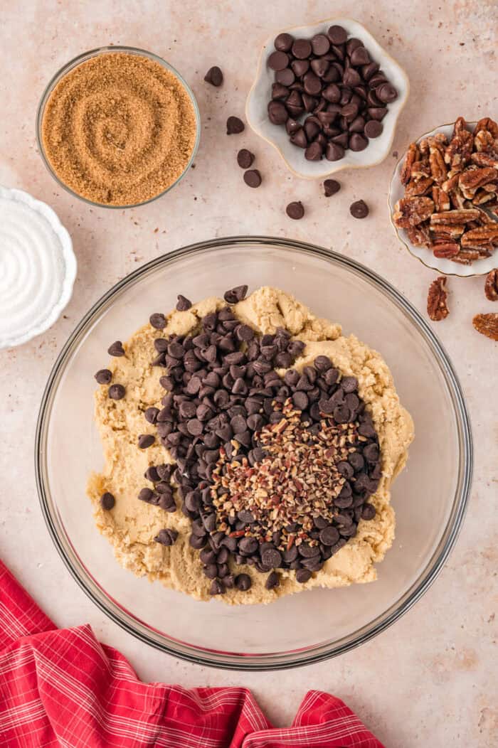 Chocolate chips and nuts added to cookie dough