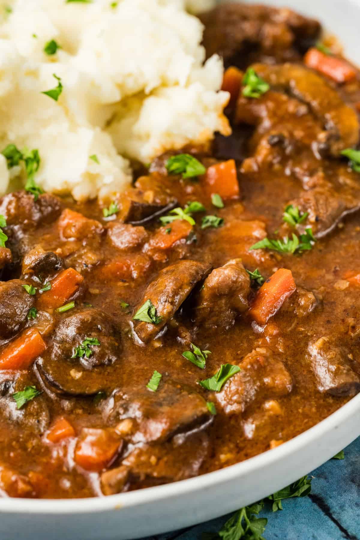 With tender chunks of beef and mushrooms simmered in a savory, aromatic broth, this Beef and Mushroom Stew is hearty and comforting. Beef and Mushroom Stew in a bowl