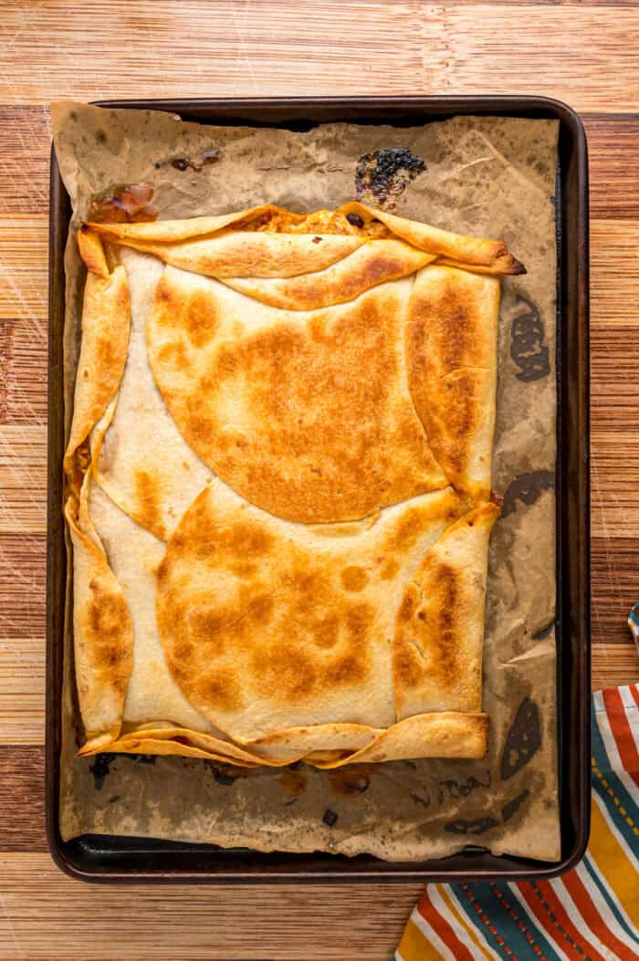 A baked quesadilla on a sheet pan