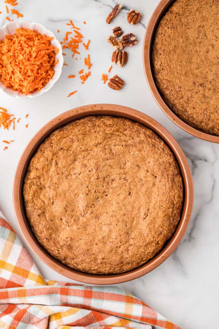 A baked carrot cake in a round pan