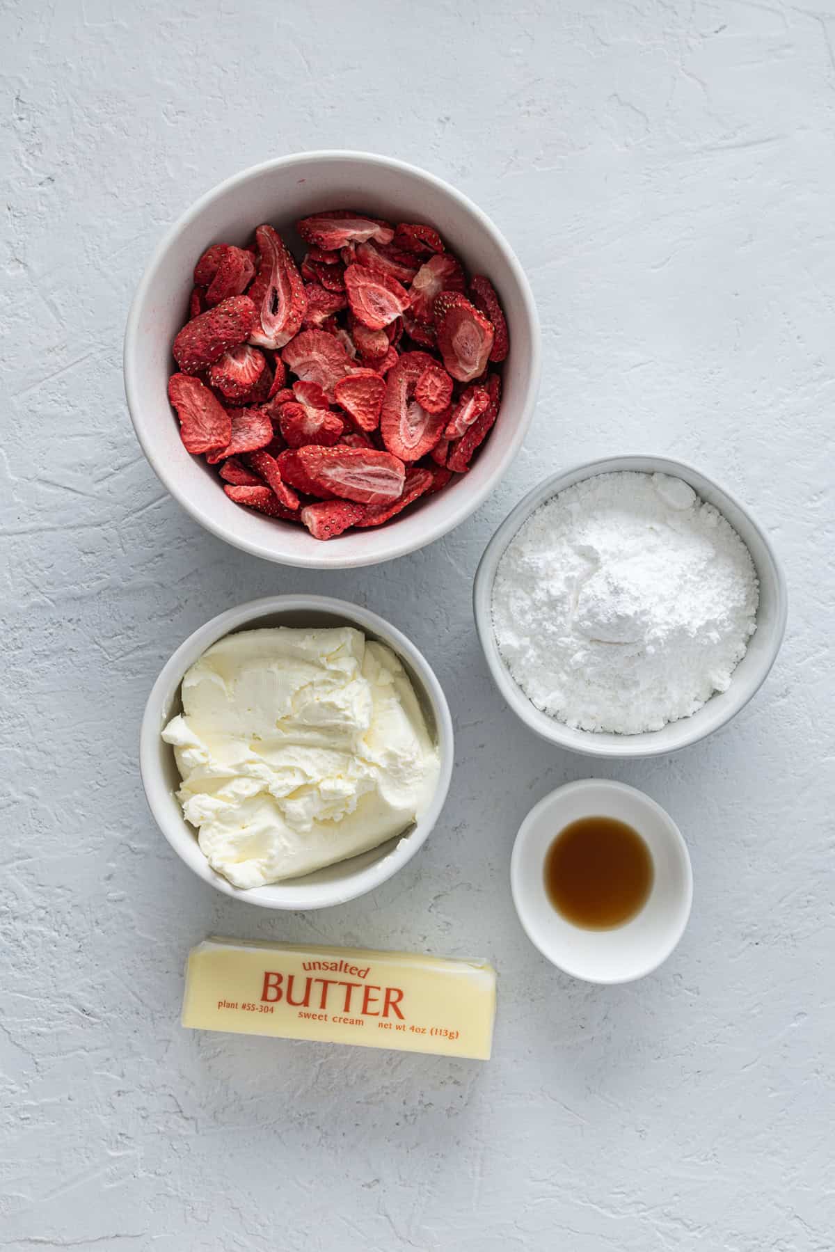 Overhead view of ingredients needed to make strawberry cream cheese frosting