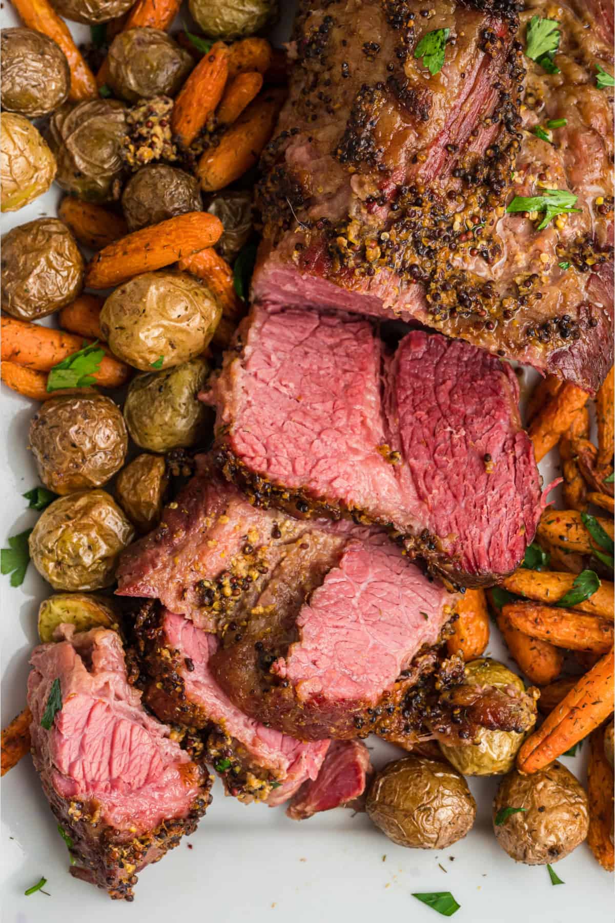 This baked corned beef brisket is slowly cooked in the oven with just 3-ingredients. Baked Corned Beef with vegetables