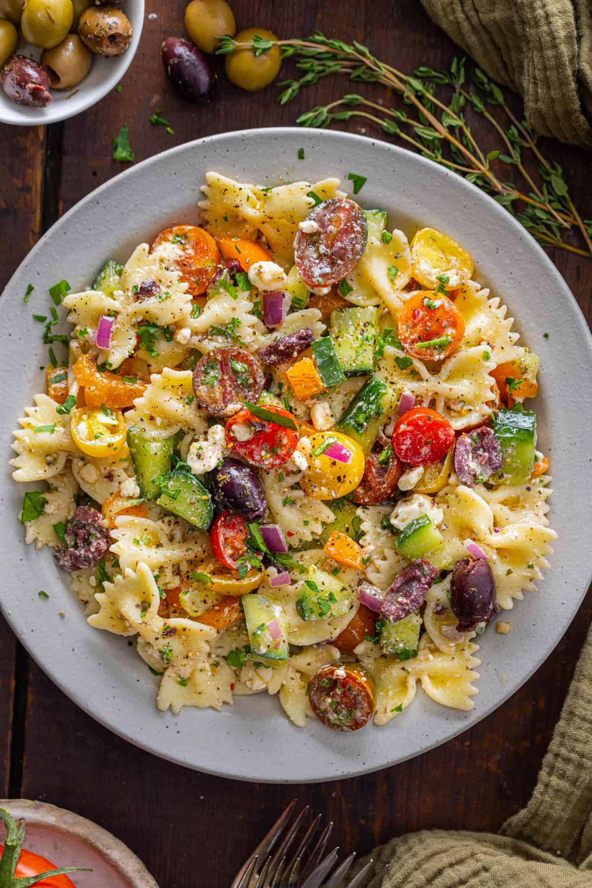 Overhead view of a plate of Greek pasta salad