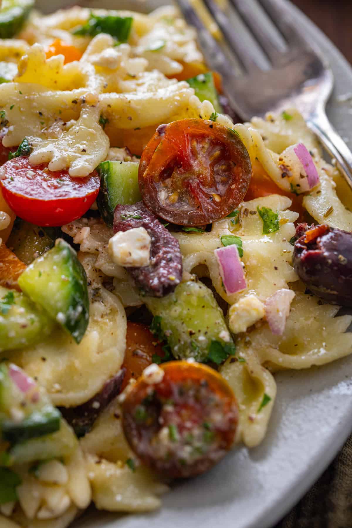 Close up of a plate of Greek pasta salad