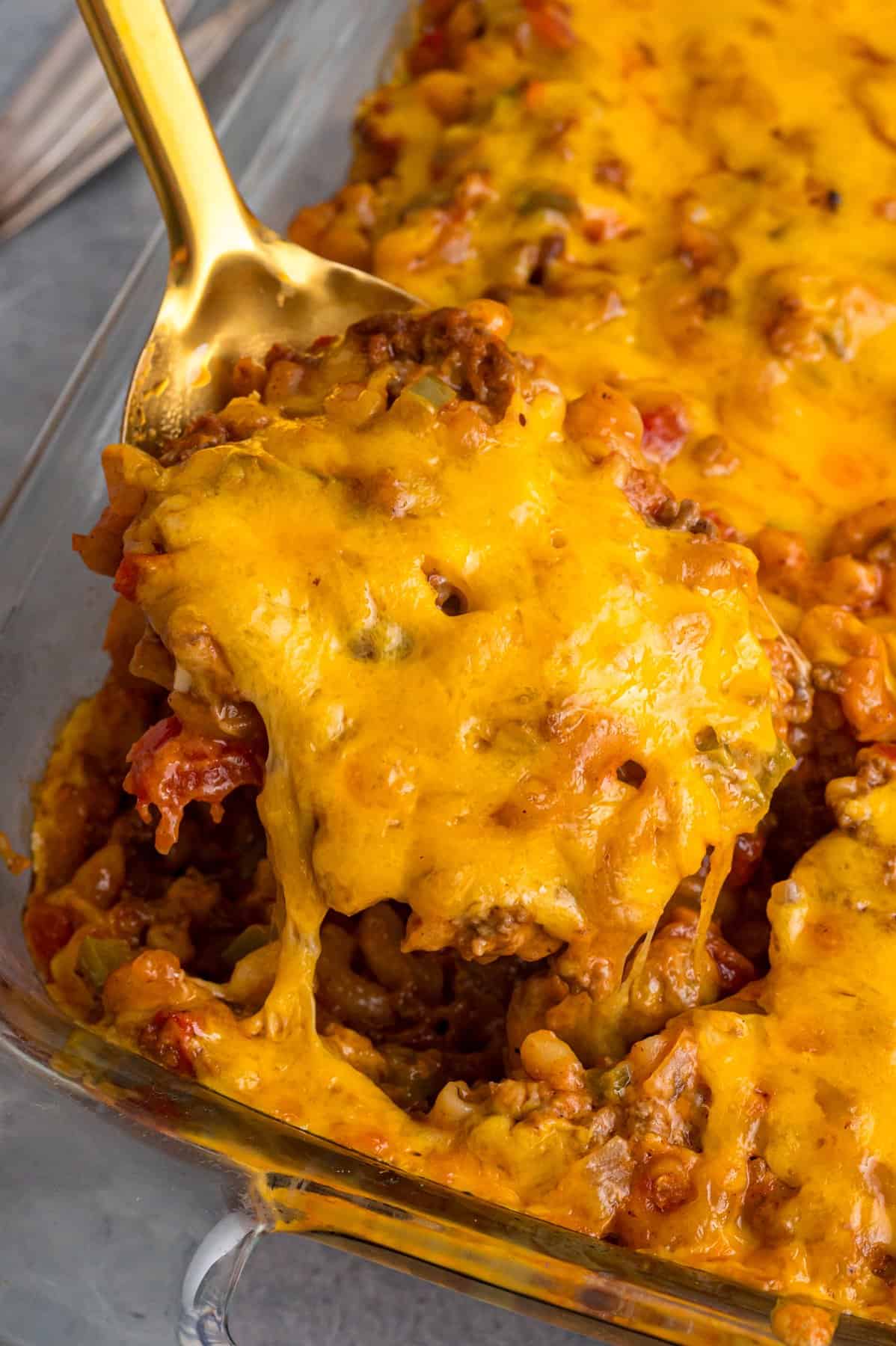 Serving a portion of sloppy joe casserole