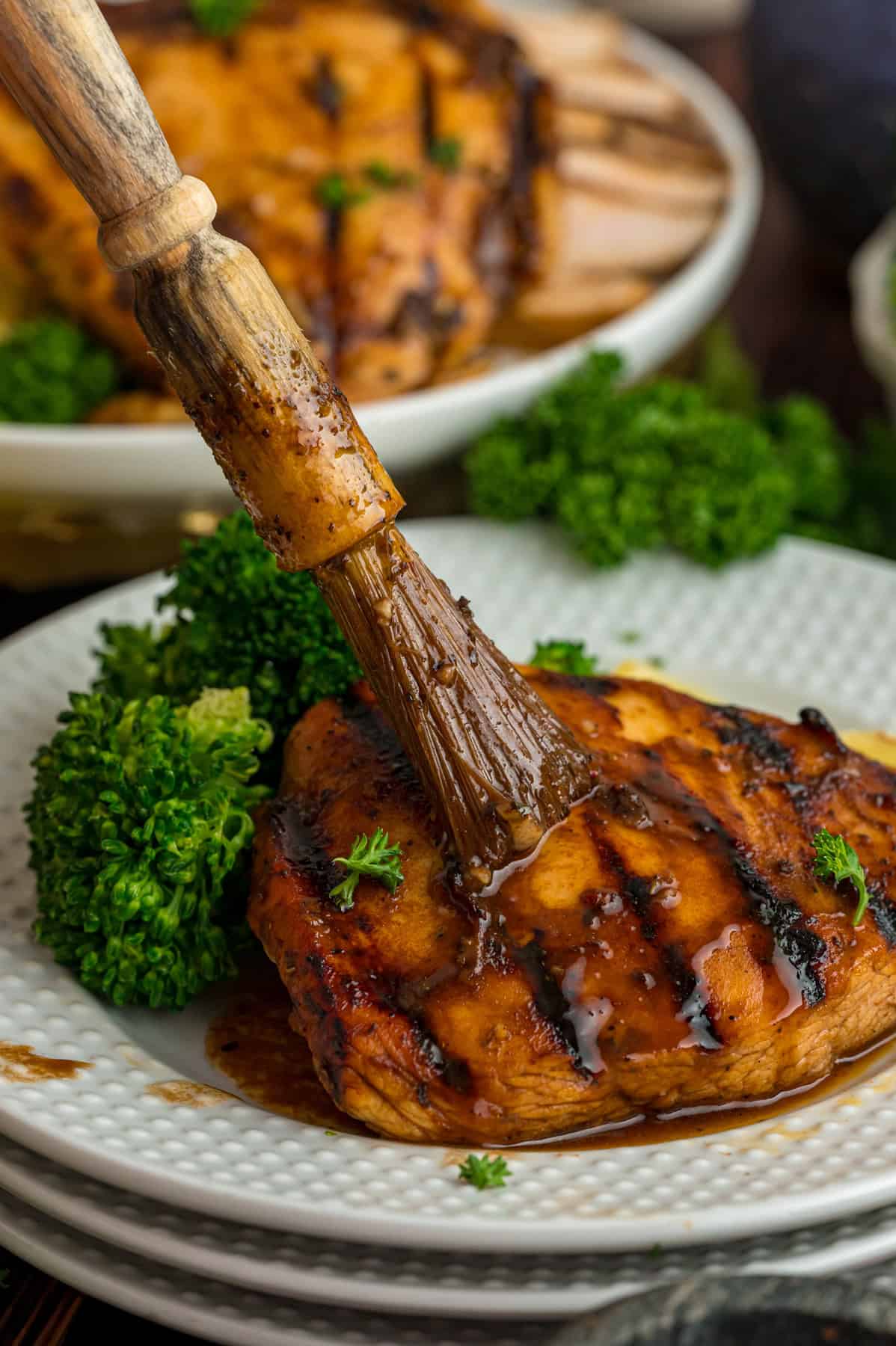 With balsamic vinegar, honey, Dijon mustard, lemon juice, and spices, this Grilled Chicken Marinade results in juicy and flavorful chicken. Brushing grilled chicken marinade on chicken
