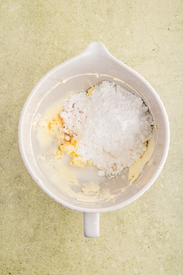 Creamed butter and powdered sugar in a bowl