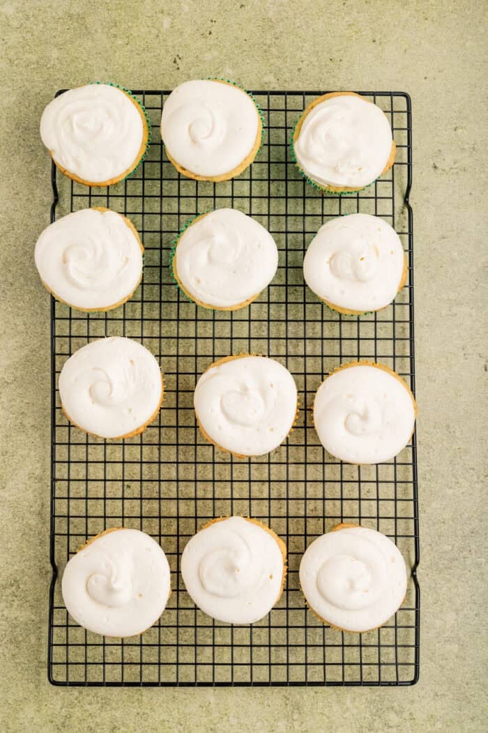 Overhead view of frosted pineapple coconut cupcakes