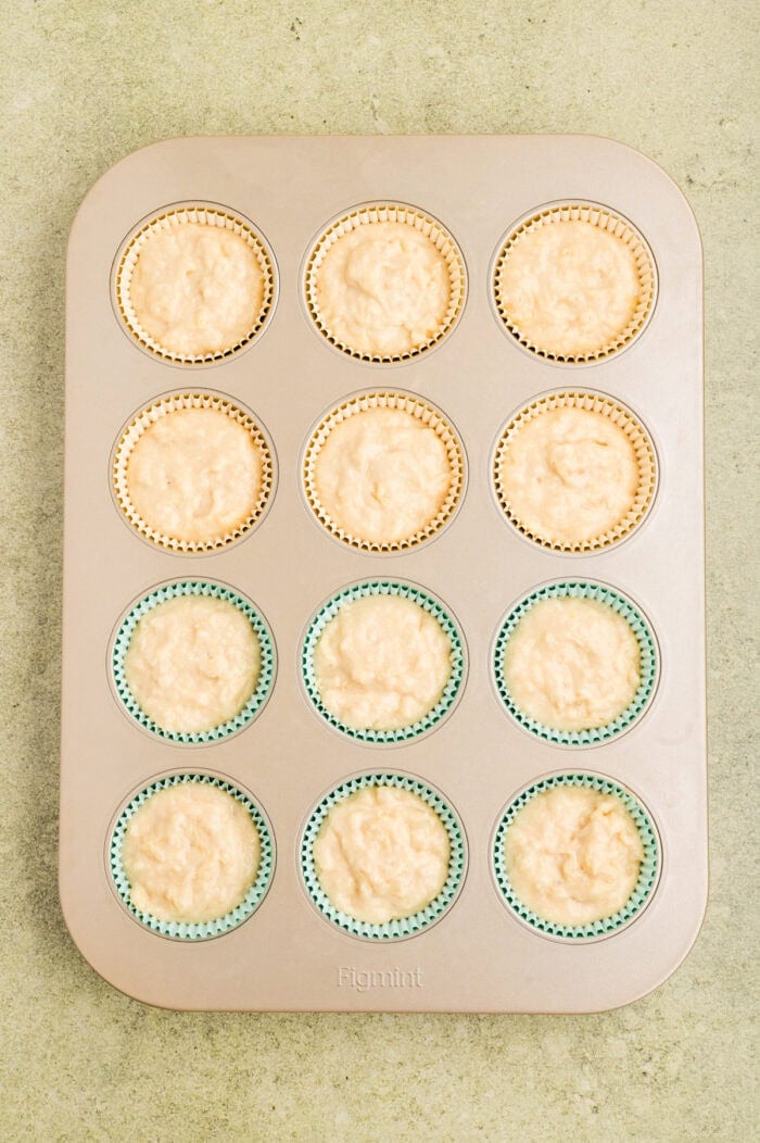 Pineapple coconut cupcake batter in liners