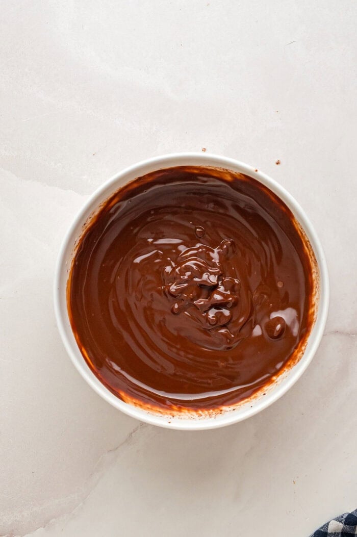 Melted chocolate ganache in a bowl