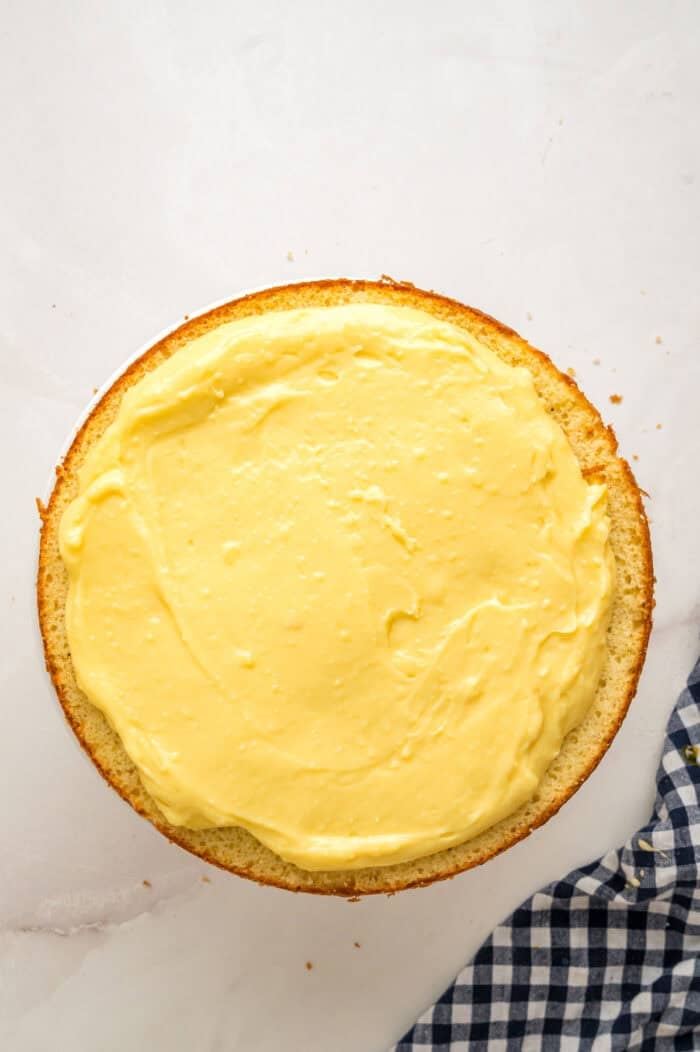 Pastry cream spread on a cake layer