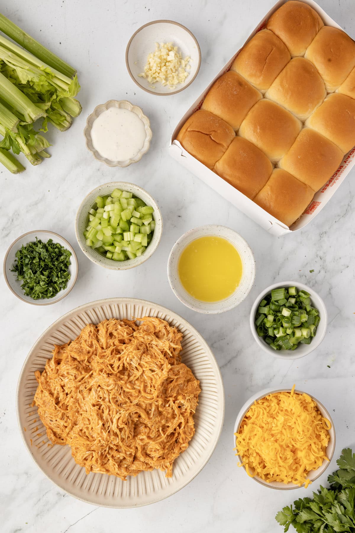 Overhead view of ingredients needed for buffalo chicken sliders