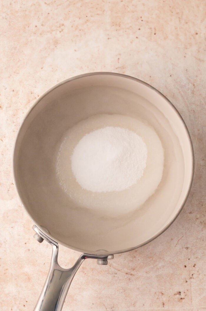 Water and sugar in a pan