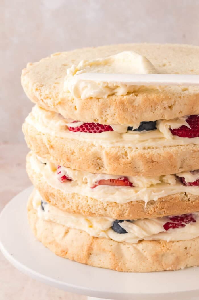 Layers of vanilla cake, Chantilly cream, and fresh berries
