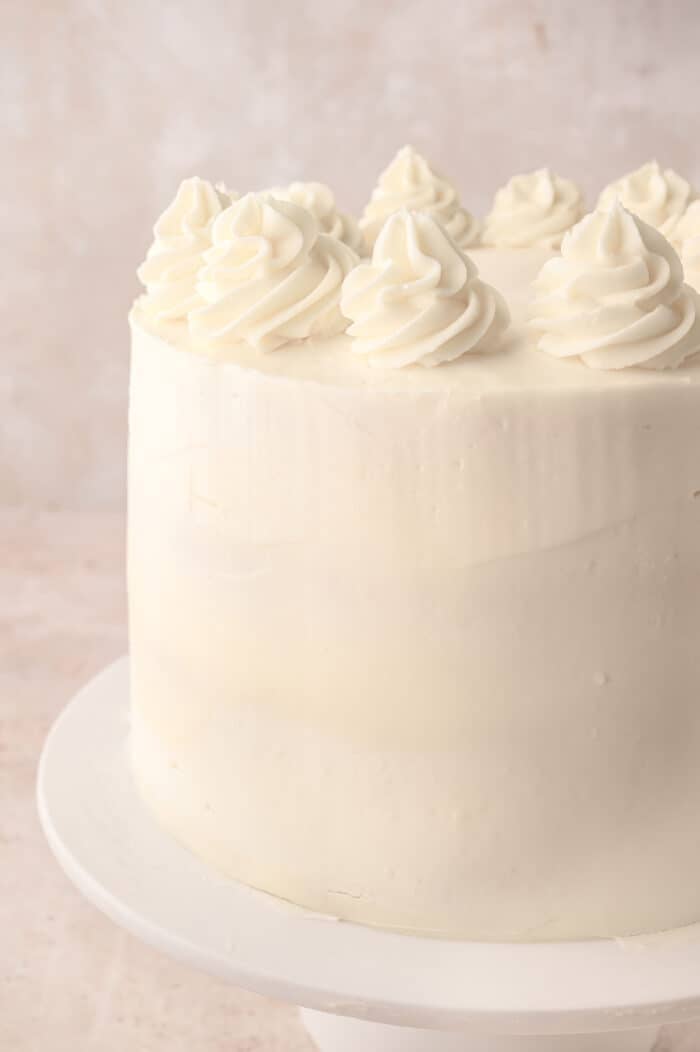 A layer cake decorated with Chantilly cream