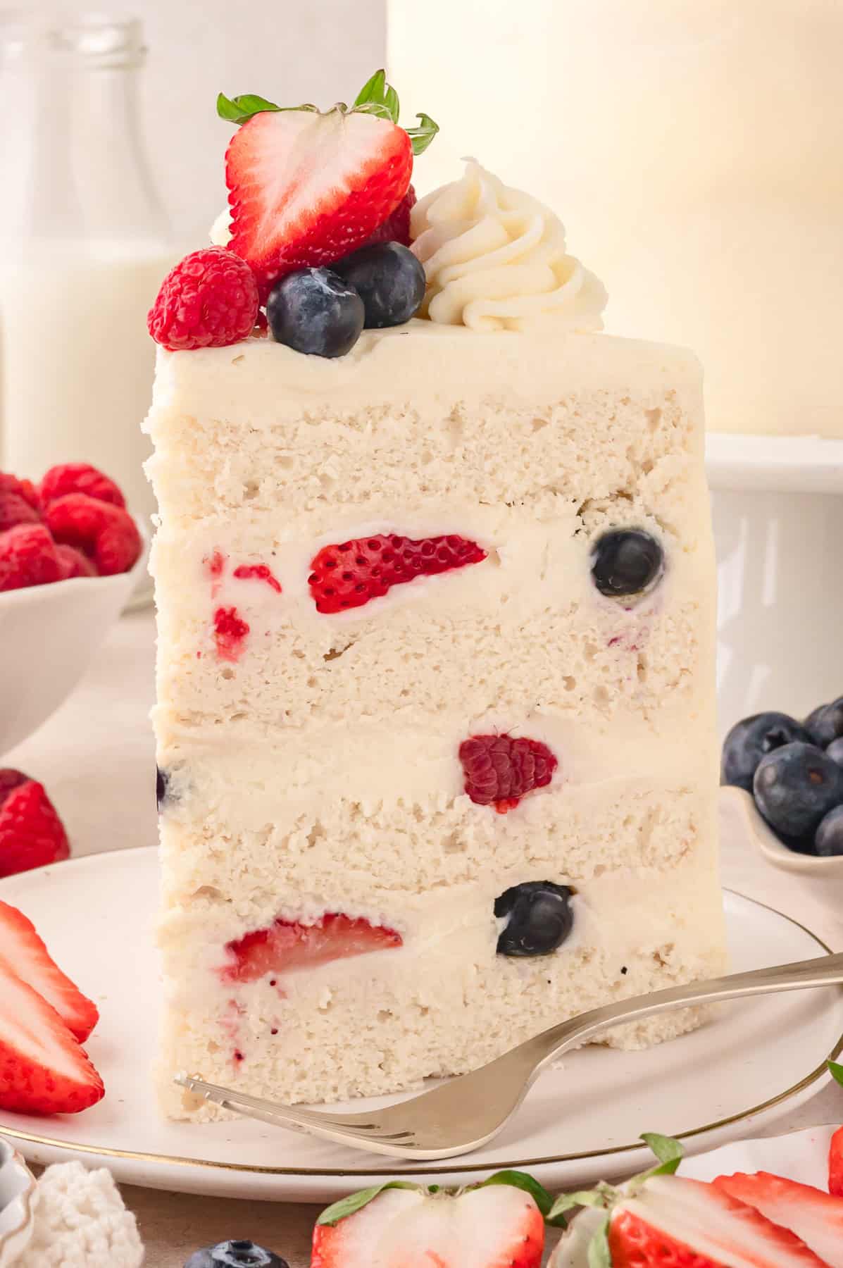 A slice of Chantilly cake on a plate