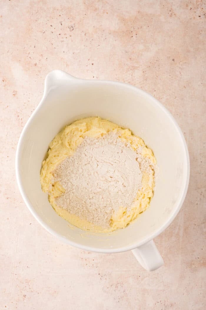 Adding dry ingredients to creamed butter and sugar