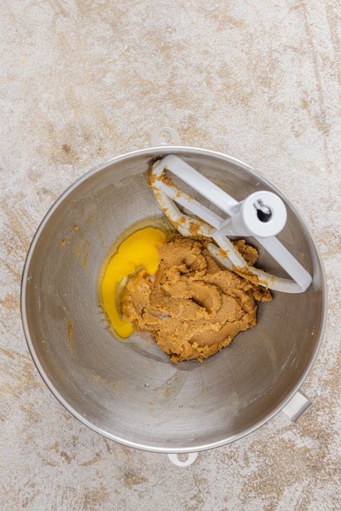 Adding egg to creamed butter and sugar