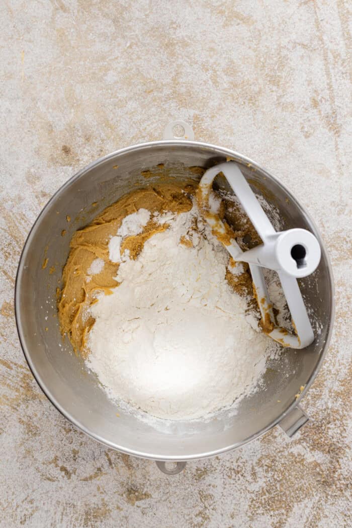 Adding dry ingredients to wet cookie dough ingredients