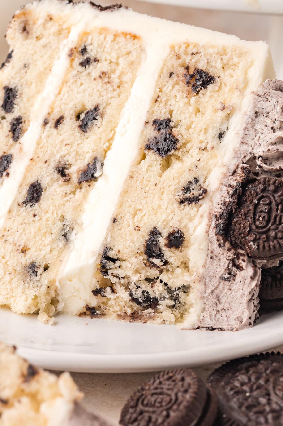 A slice of Oreo cake on a white plate