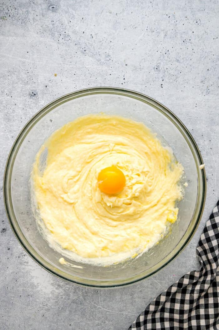 Egg yolk being mixed into batter
