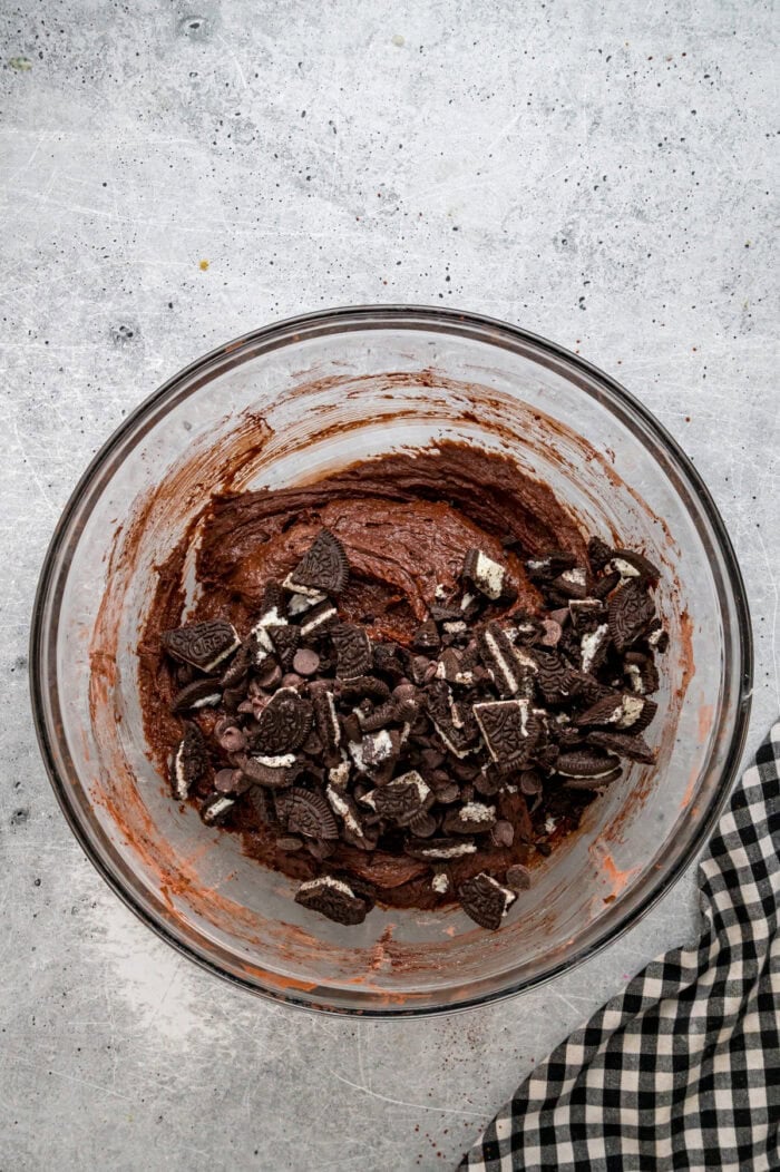 Adding Oreo pieces to brownie batter